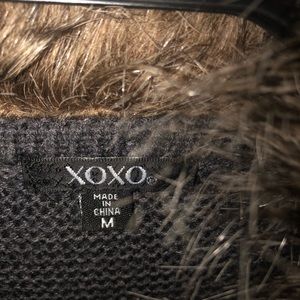 Ladies cardigan sweater with faux fur collar.